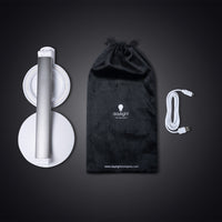 The Daylight Company Halo Go 2 Magnifying Lamp with pouch and USB cable on a dark surface, front view.
