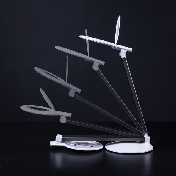 Daylight Company Halo Go 2 Magnifying Lamp with adjustable arm and flexible head, shown from multiple angles, dark background.