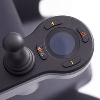 Urathon Hero Carbon Fibre Powerchair control panel with joystick, screen and orange power buttons, close-up.