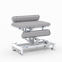 Hydraulic changing table, MRSA-resistant, padded surface, side rails, metal frame on wheels, NHS-approved, front view.