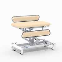 Medi-Plinth hydraulic changing table with MRSA-resistant upholstery, silver rails and white wheeled frame, side view.