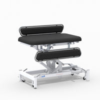 Medi-Plinth hydraulic changing table with MRSA-resistant padded surface and mobile metal frame, side view.