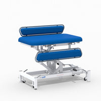 Medi-Plinth hydraulic changing table with safety rails, padded surface and lockable wheels, side view.