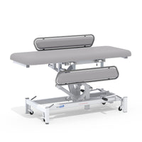 Medi-Plinth Hydraulic Changing Table with MRSA-resistant padding, side rails and wheels, height-adjustable, front view.