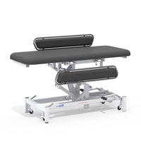 Medi-Plinth hydraulic changing table with MRSA-resistant upholstery, side rails and lockable wheels, side view.