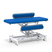 Medi-Plinth hydraulic changing table with metal side rails and white wheeled frame, against a white background, side view.