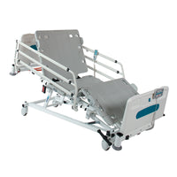 Sidhil Innov8 iQ hospital bed with side rails, remote, wheels and optional underbed lighting, white background, angled view.