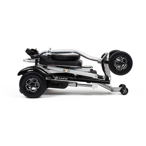 Drive Instafold Folding Mobility Scooter with silver frame, folded on its side against a white background, side view.