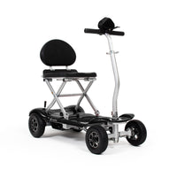 Drive Instafold folding mobility scooter with four wheels, cushioned seat and automatic folding, side view.