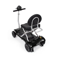 Drive Instafold Folding Mobility Scooter with four wheels, padded seat and rear handlebars, side view.