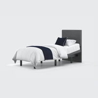 Opera Beds Jade Motion Adjustable Bed with headboard, white bedding, dark blue throw and pillow, front view.