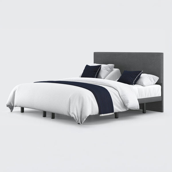 Opera Beds Jade Motion Adjustable Bed with headboard, white bedding and navy blue accents, front view.