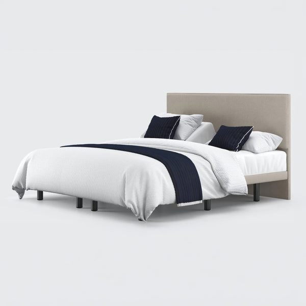 Opera Beds Jade Motion Adjustable Bed with headboard, white bedding and navy blue accents, front view.