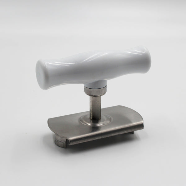 Aidapt jar opener with plastic handle, metal grip for opening jars, on a plain background, top view.
