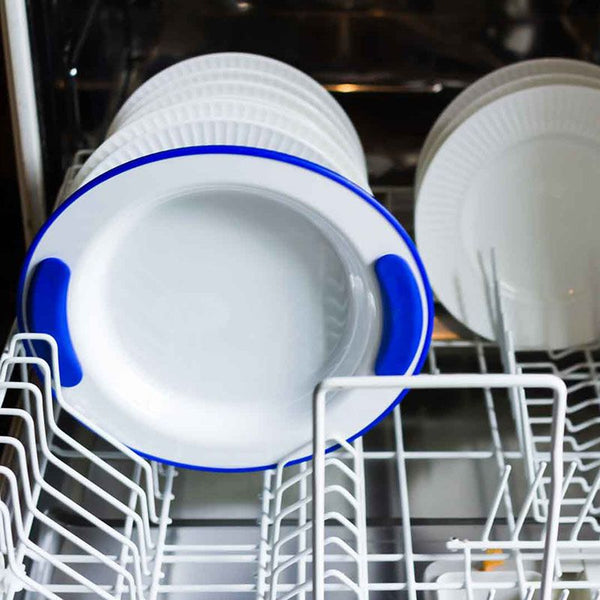 ORNAMIN Keep Warm Plate with white plates arranged in an open dishwasher, inside view.