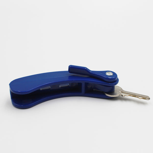Key turner for two keys with comfort grip handle and metal key inserted, white background, front view.