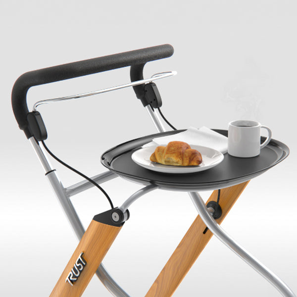 Let’s Go Indoor Rollator with tray holding a mug, plate with croissant, and napkin, plain background, front view.