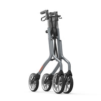 Trust Care Let’s Move aluminium rollator with large wheels, shown folded upright for easy moving, side view.