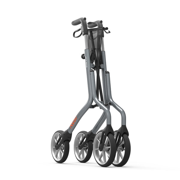 Trust Care Let’s Move aluminium rollator with large wheels, shown folded upright for easy moving, side view.