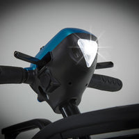 Motion Healthcare Lithilite Scooter with handlebars, lit triangular headlight and lightweight lithium battery, close-up.