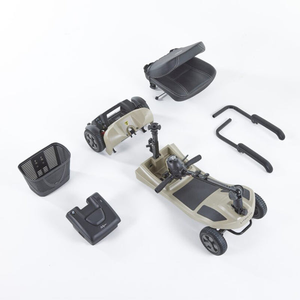 Disassembled Motion Healthcare Lithilite Scooter with seat, basket, puncture-proof wheels, and lithium battery on white background, side view.