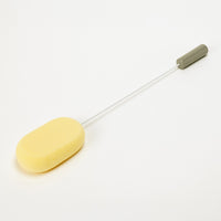 Homecraft Long Handled Sponge with oval head, long handle and grip on white background, side view.