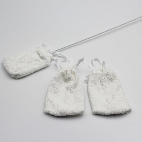 Homecraft toe washer with long handle and two spare pads, top view.