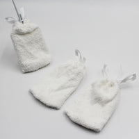 Set of three small drawstring pouches for storing replacement pads, shown grouped together, front view.