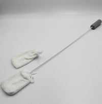 Homecraft long handled toe washer with two white fuzzy cleaning cloths for foot washing, angled side view.