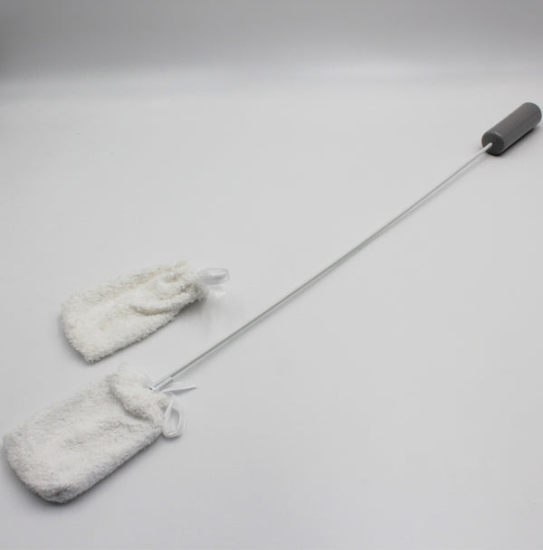 Homecraft long handled toe washer with two white fuzzy cleaning cloths for foot washing, angled side view.