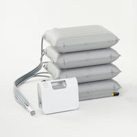 Mangar ELK portable lifting cushion with four grey cushions and a white control unit, used for helping after falls, front view.