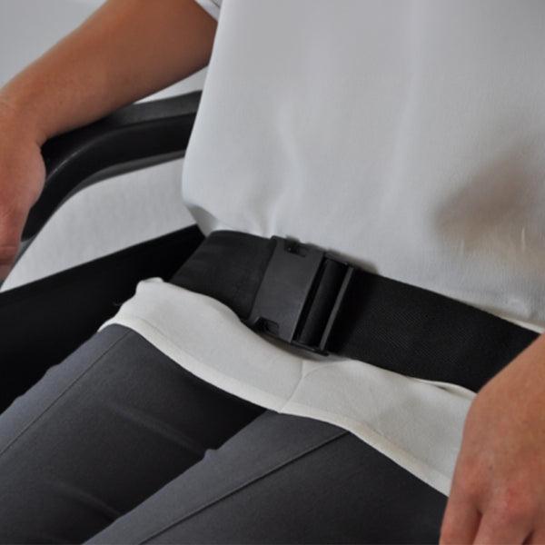 Able2 Mobility Lap Belt with quick-release buckle worn by a seated person, in use view.