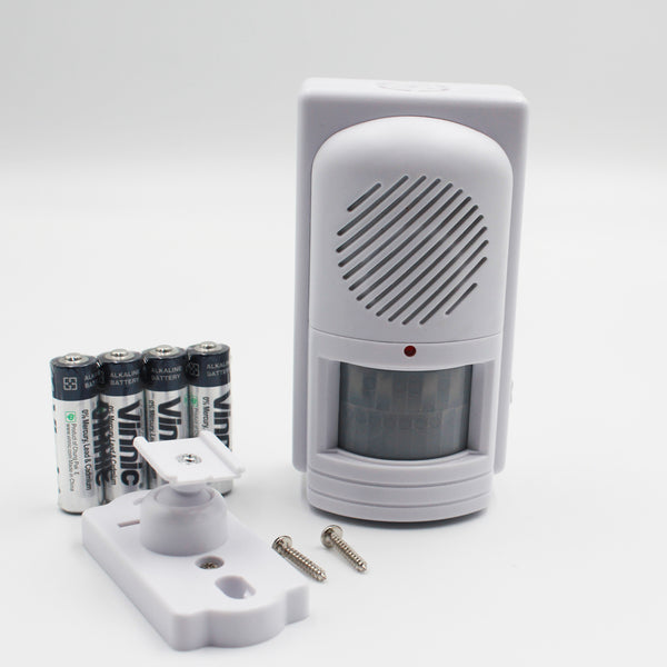 Easy Link motion activated memo reminder with voice recorder, 4 AA batteries, bracket and screws, front view.