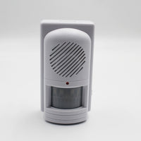 Easy Link motion activated memo reminder with speaker grill, red light and curved window, front view.