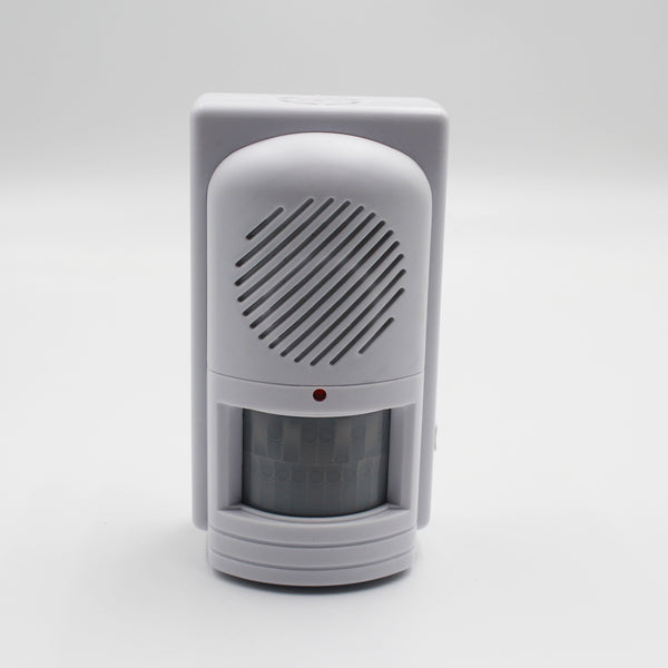 Easy Link motion activated memo reminder with speaker grill, red light and curved window, front view.