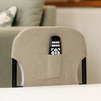 Remote in pocket on back of Opera Beds Motion Bed Grab Rail next to adjustable bed, rear view.