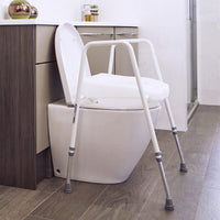 NRS Mowbray Lite Toilet Aid with adjustable height and armrests, shown in a modern bathroom setting, front view.