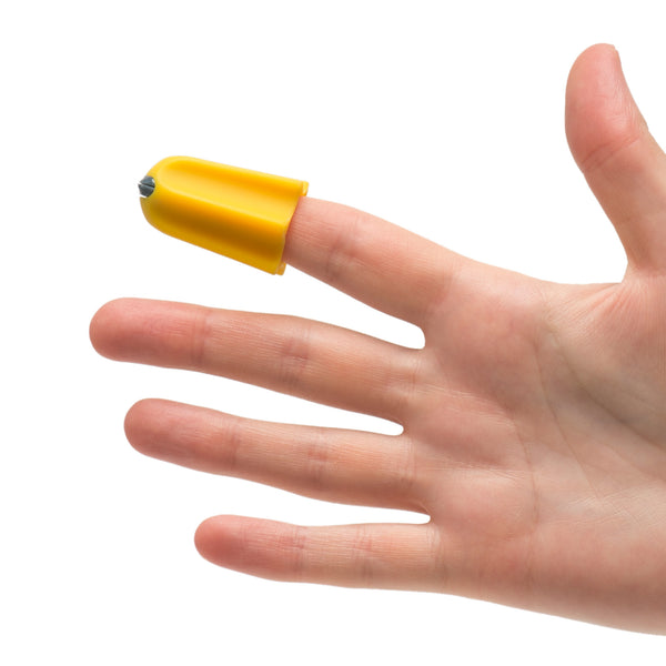 Hand using RNIB Nimble One-Finger Cutting Tool on index finger to open packaging, white background, in use view.