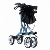 Drive Nitro SL Rollator with four large wheels, ergonomic adjustable handles, hand brakes and black storage bag, side view.