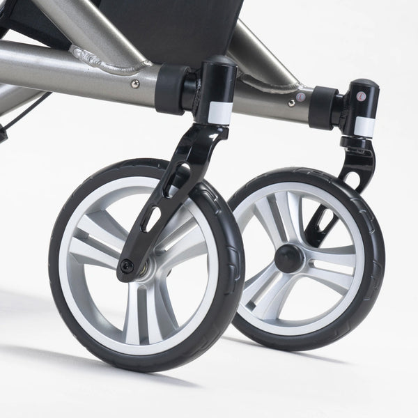 Close-up of two black and silver wheels on the Drive Nitro SL Rollator attached to its aluminium frame, white background, close-up view.