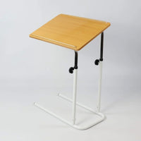 NRS Divan overbed table with adjustable height, wooden top and metal legs, suitable for wheelchairs, side view.