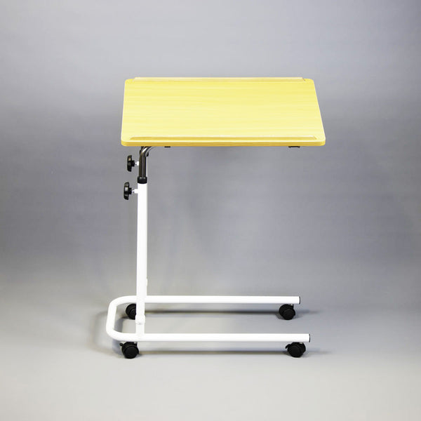 NRS Overbed or overchair table with light wood top, white metal frame and four black castors, front angle view.