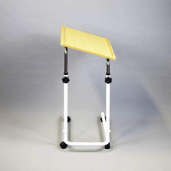 NRS Overbed/Overchair Table with wheels and white metal legs, plain background, front view.