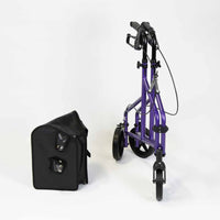 NRS Three Wheel Aluminium Rollator folded next to black carrying case on white background, side view.