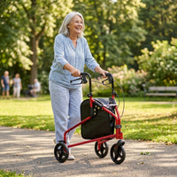 Senior using NRS Three Wheel Steel Rollator walking in a sunny park with trees and grass, in use.