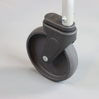 Caster wheel on NRS Walk Safe Walking Frame attached to metal leg, plain background, close-up.