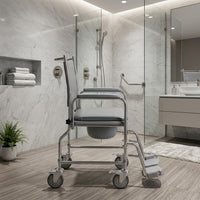 NRS wheeled commode with height adjustable frame in a modern bathroom setting, marble and glass visible, side view.