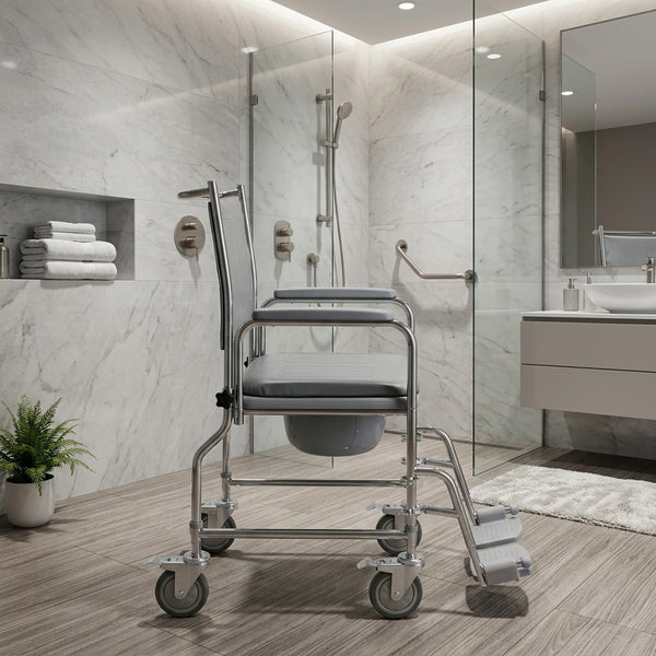 NRS wheeled commode with height adjustable frame in a modern bathroom setting, marble and glass visible, side view.