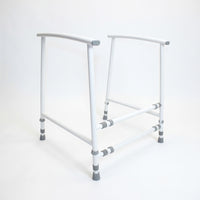 NRS Nuvo Adjustable Toilet Frame with metal frame and grey tips, height adjustable for bathroom support, front view.