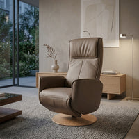 Orla Riser Recliner Swivel Chair on a round wooden base, front view.